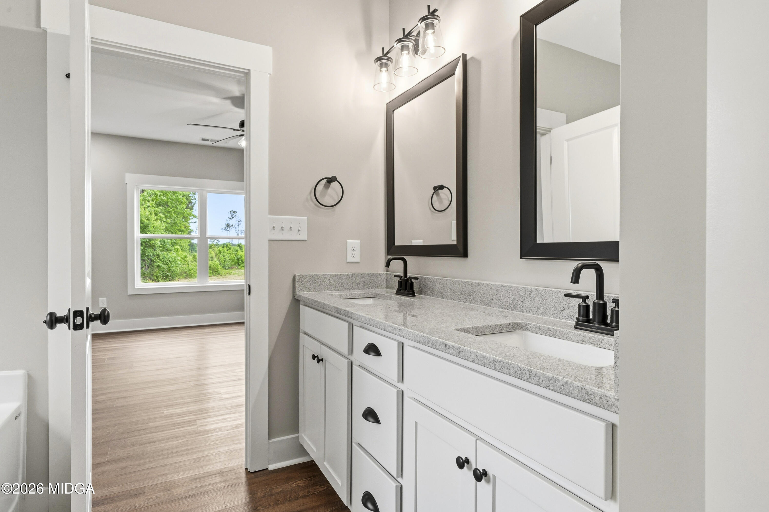 146 Overland Way Gray, GA 31032 - Photo 27 of 38 a bathroom with a double vanity sink and a mirror