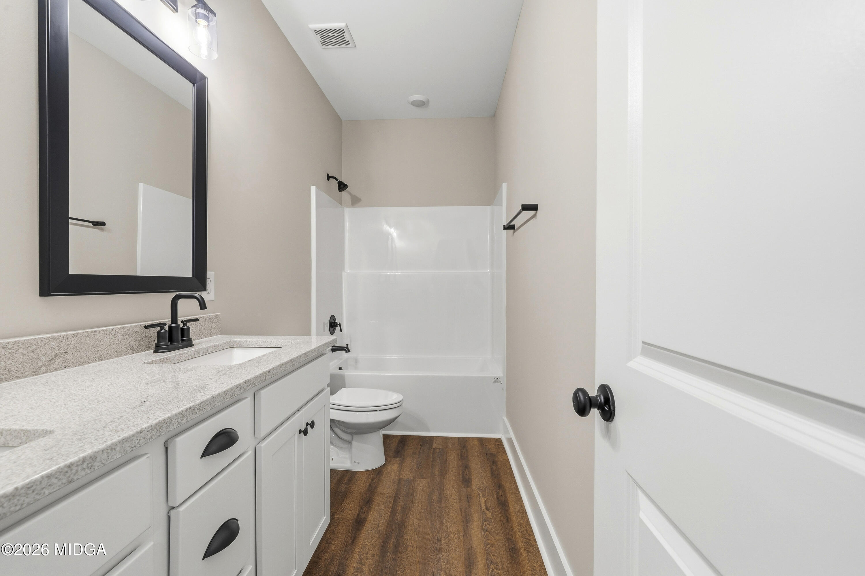 146 Overland Way Gray, GA 31032 - Photo 30 of 38 a bathroom with a sink a toilet and a mirror