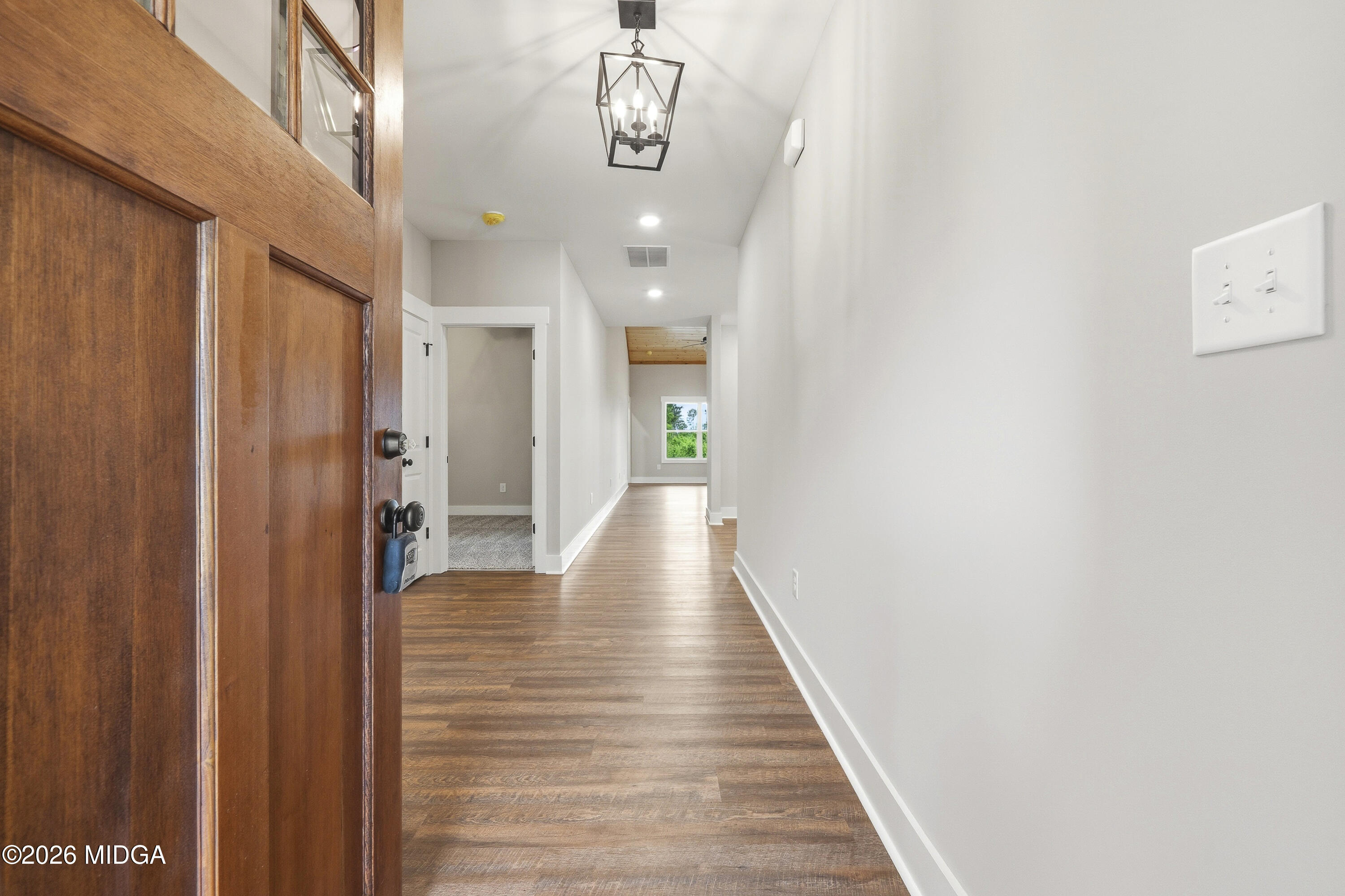 146 Overland Way Gray, GA 31032 - Photo 4 of 38 a view of a hallway with wooden floor