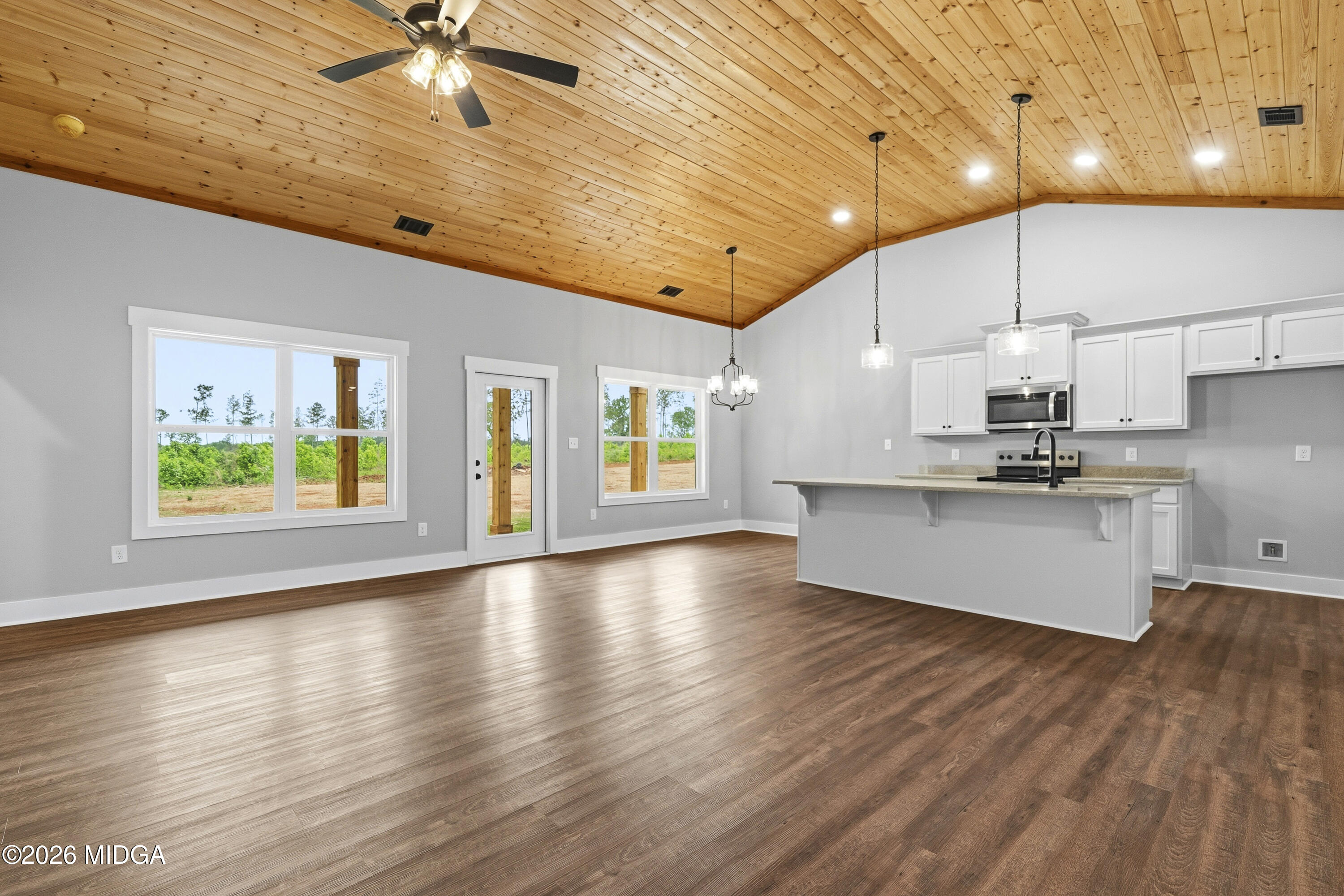 146 Overland Way Gray, GA 31032 - Photo 5 of 38 a view of an empty room with kitchen and a window