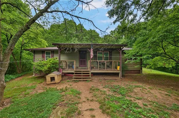 a view of an house with backyard space and garden