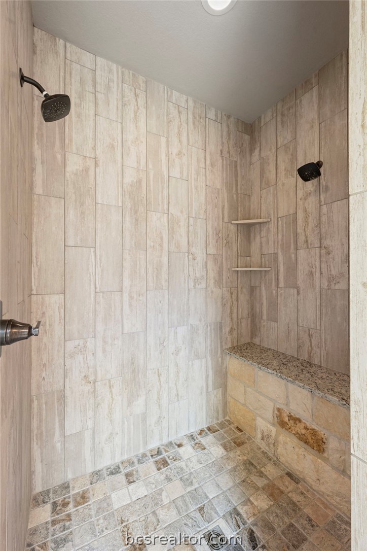 3028 Embers Loop Bryan, TX 77808 - Photo 13 of 26 Bathroom featuring tiled shower