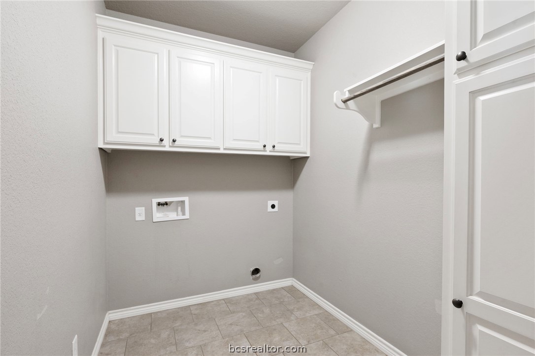 3028 Embers Loop Bryan, TX 77808 - Photo 21 of 26 Laundry room featuring cabinet space, washer hookup, and hookup for an electric dryer