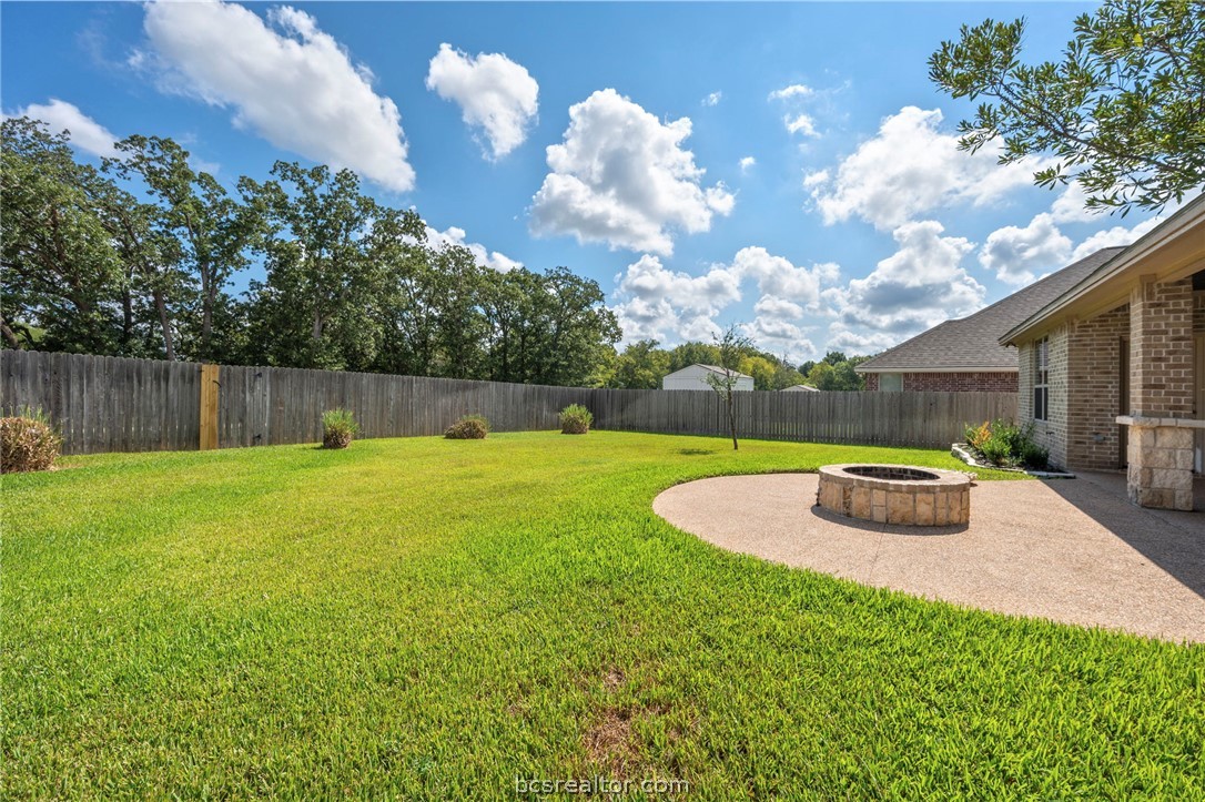 3028 Embers Loop Bryan, TX 77808 - Photo 23 of 26 Fenced backyard featuring a patio and an outdoor fire pit
