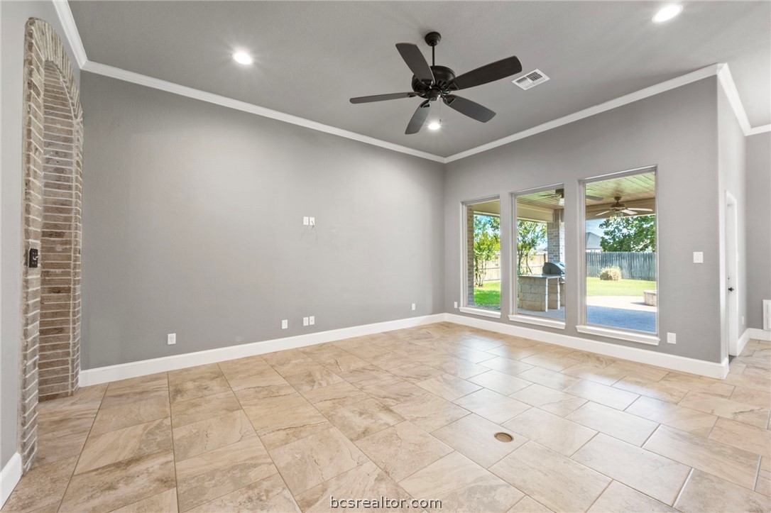 3028 Embers Loop Bryan, TX 77808 - Photo 4 of 26 Empty room featuring ornamental molding and recessed lighting