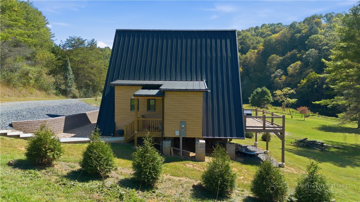 355 South River Hills Road Lansing, NC 28643 - Photo 35 of 45 an aerial view of a house with swimming pool outdoor seating and yard