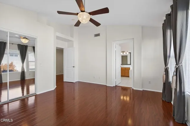 a bathroom with a sink vanity granite shower and a mirror