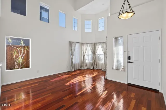 a view of a livingroom with furniture and chandelier