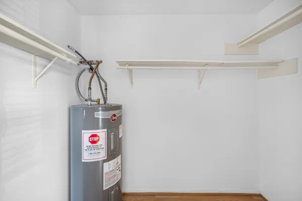 a view of storage and utility room with washer and dryer