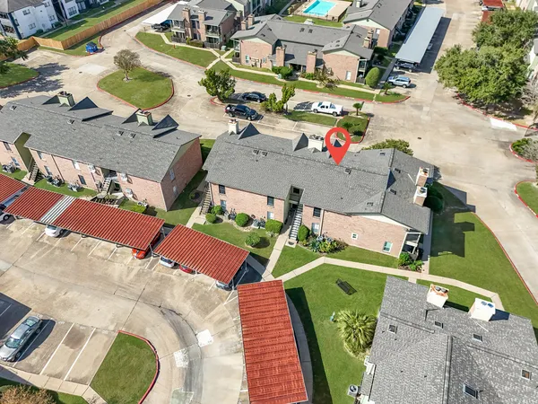 an aerial view of a houses with outdoor space