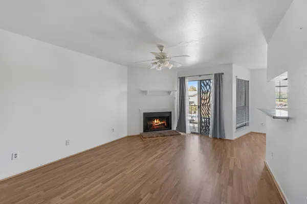 wooden floor in an empty room with a fireplace