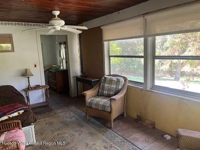 a living room with furniture and a window