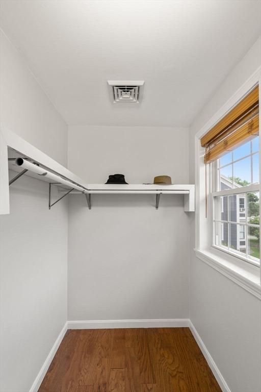 104 Crescent Street, Unit 1 Waltham, MA 02453 - Photo 15 of 30 a view of storage and utility room with racks on the wall