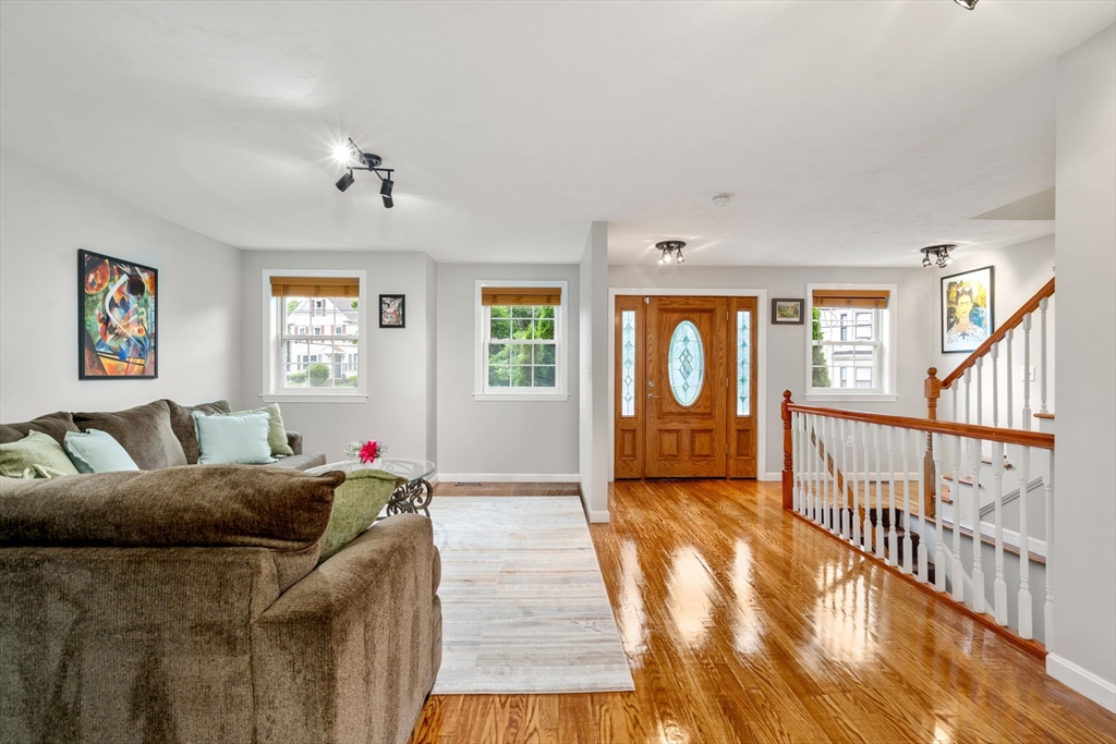 104 Crescent Street, Unit 1 Waltham, MA 02453 - Photo 3 of 30 a bedroom with furniture and a window