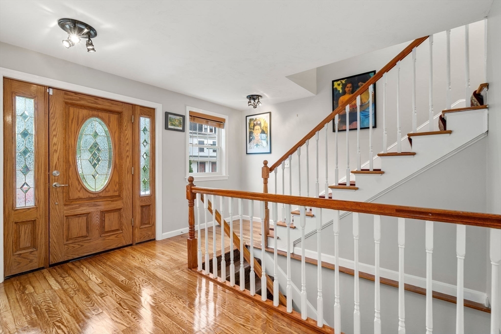 104 Crescent Street, Unit 1 Waltham, MA 02453 - Photo 10 of 30 a view of a hallway with wooden floor and entryway