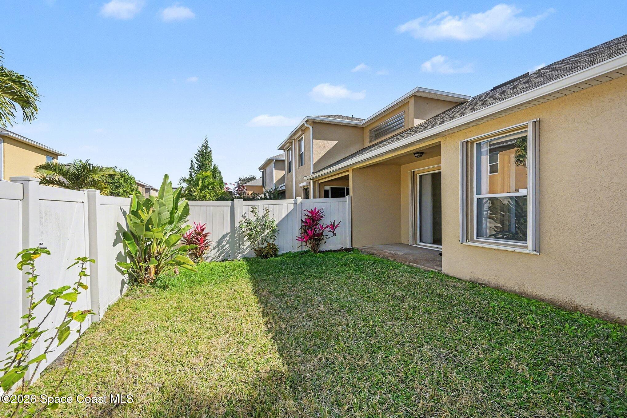3271 Arden Circle Melbourne, FL 32934 - Photo 27 of 29 a front view of a house with garden