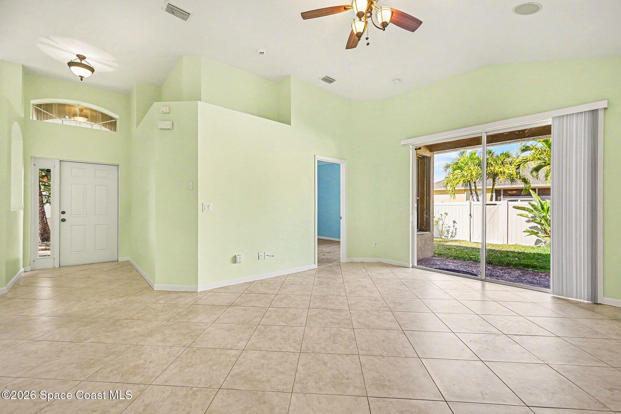 3271 Arden Circle Melbourne, FL 32934 - Photo 7 of 29 a view of an empty room with a window
