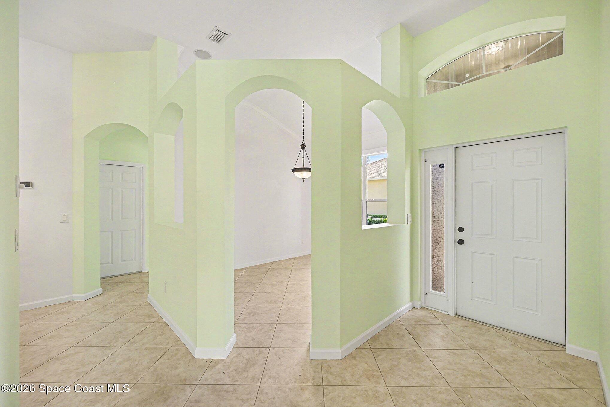 3271 Arden Circle Melbourne, FL 32934 - Photo 8 of 29 a view of a bathroom with a glass door shower