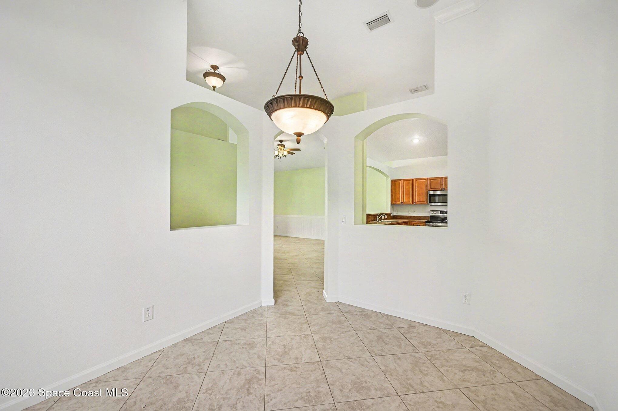 3271 Arden Circle Melbourne, FL 32934 - Photo 10 of 29 a view of a room with rack and cabinet