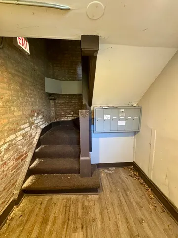 a view of a hall with stairs