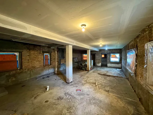 a front view of a building with a garage