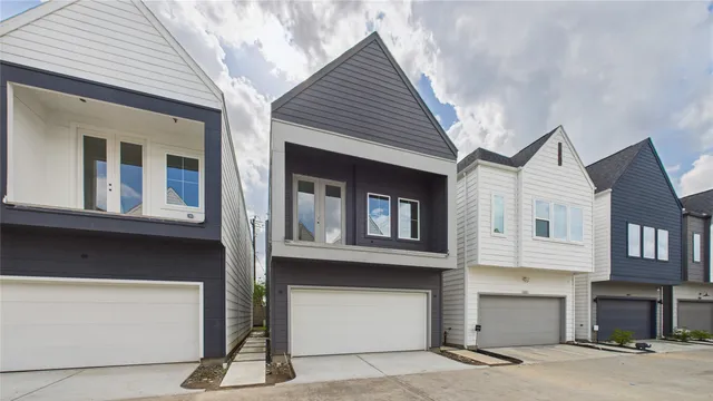 a front view of a house with a garage