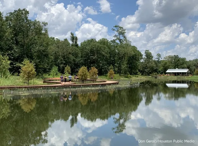 a view of a lake with a house in the background