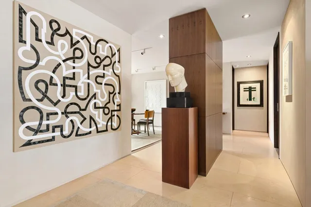 a view of a livingroom with furniture and a window