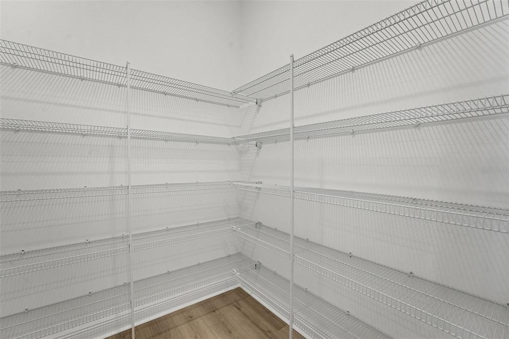 994 Fiesta Key Circle Lady Lake, FL 32159 - Photo 12 of 49 a view of a room with racks on the wall