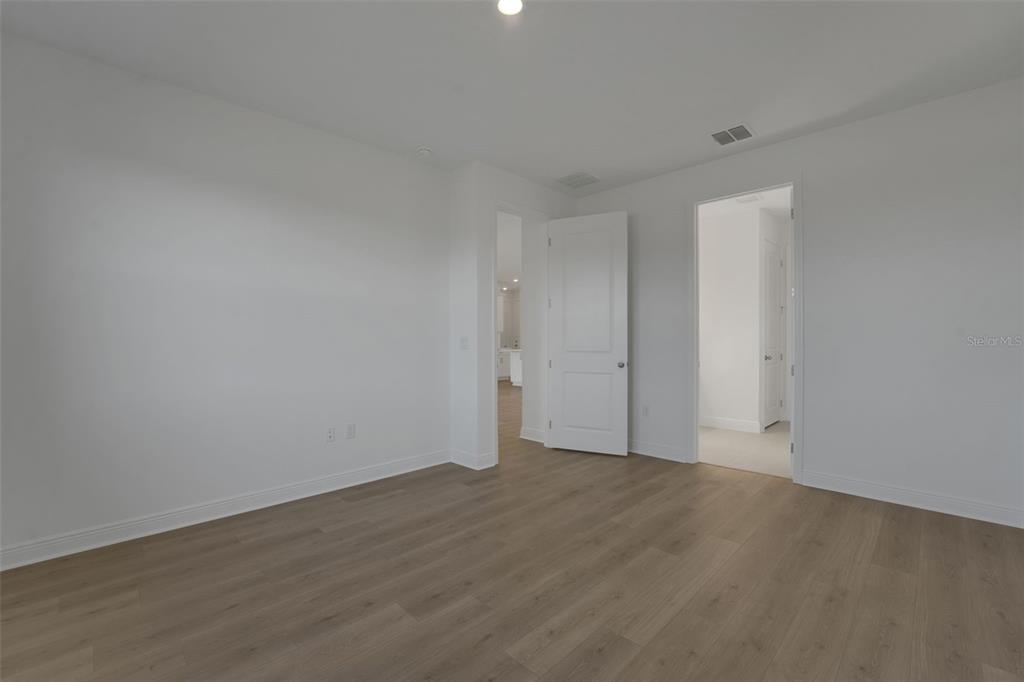 994 Fiesta Key Circle Lady Lake, FL 32159 - Photo 17 of 49 a view of an empty room