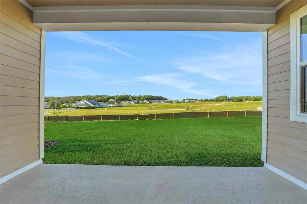 994 Fiesta Key Circle Lady Lake, FL 32159 - Photo 8 of 49 a view of a field with an outdoor space