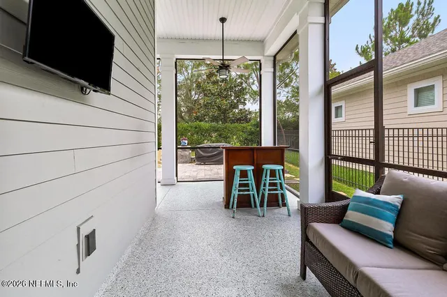 a view of a house with backyard sitting area and garden