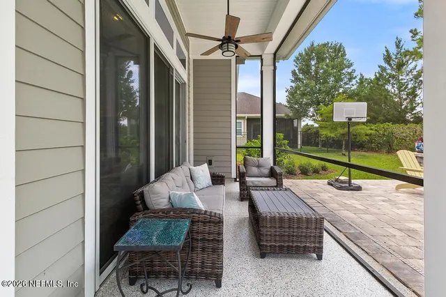 an aerial view of residential houses with outdoor space and street view