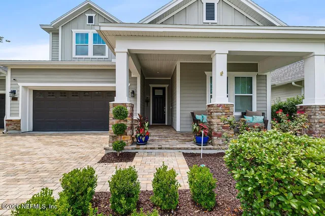 front view of a house with potted plants