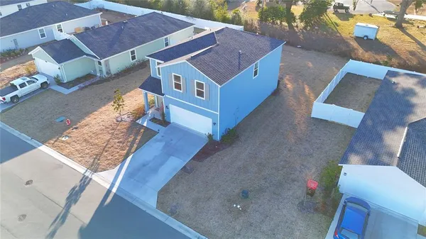a aerial view of a house with a yard
