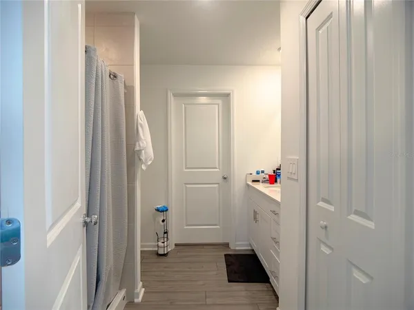 a view of an entryway with wooden floor