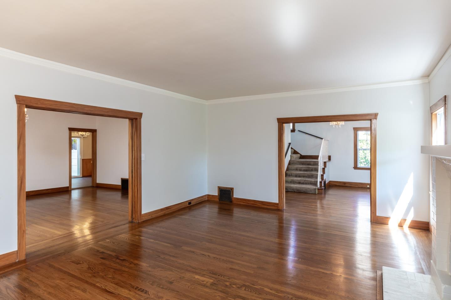 425 Hillcrest Road San Mateo, CA 94402 - Photo 13 of 48 a view of empty room with wooden floor and window