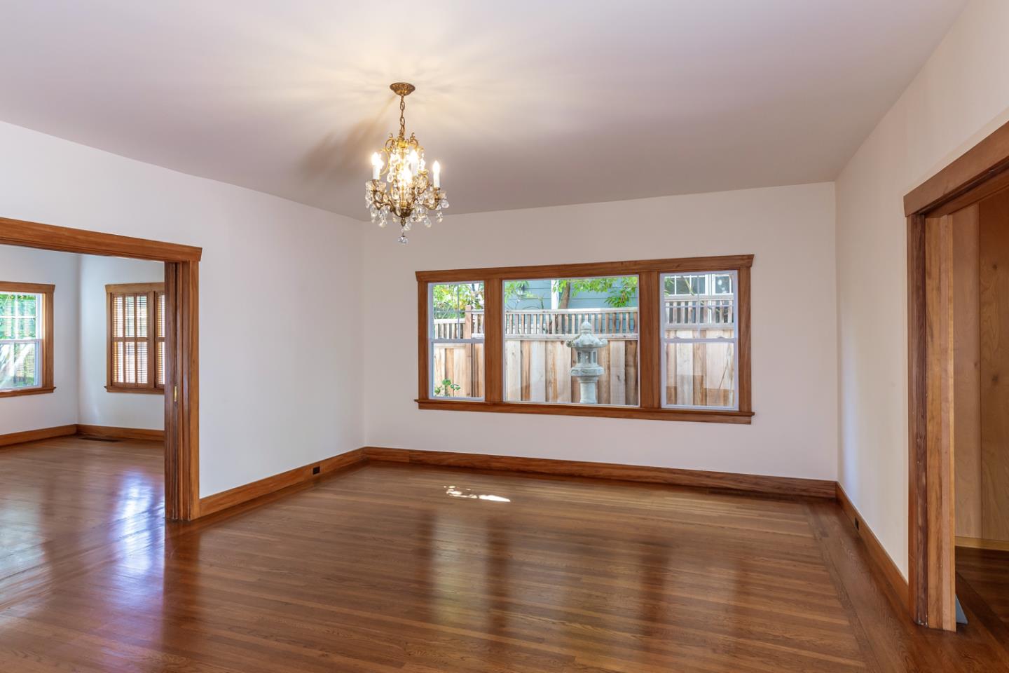 425 Hillcrest Road San Mateo, CA 94402 - Photo 14 of 48 a view of an empty room with wooden floor and a window