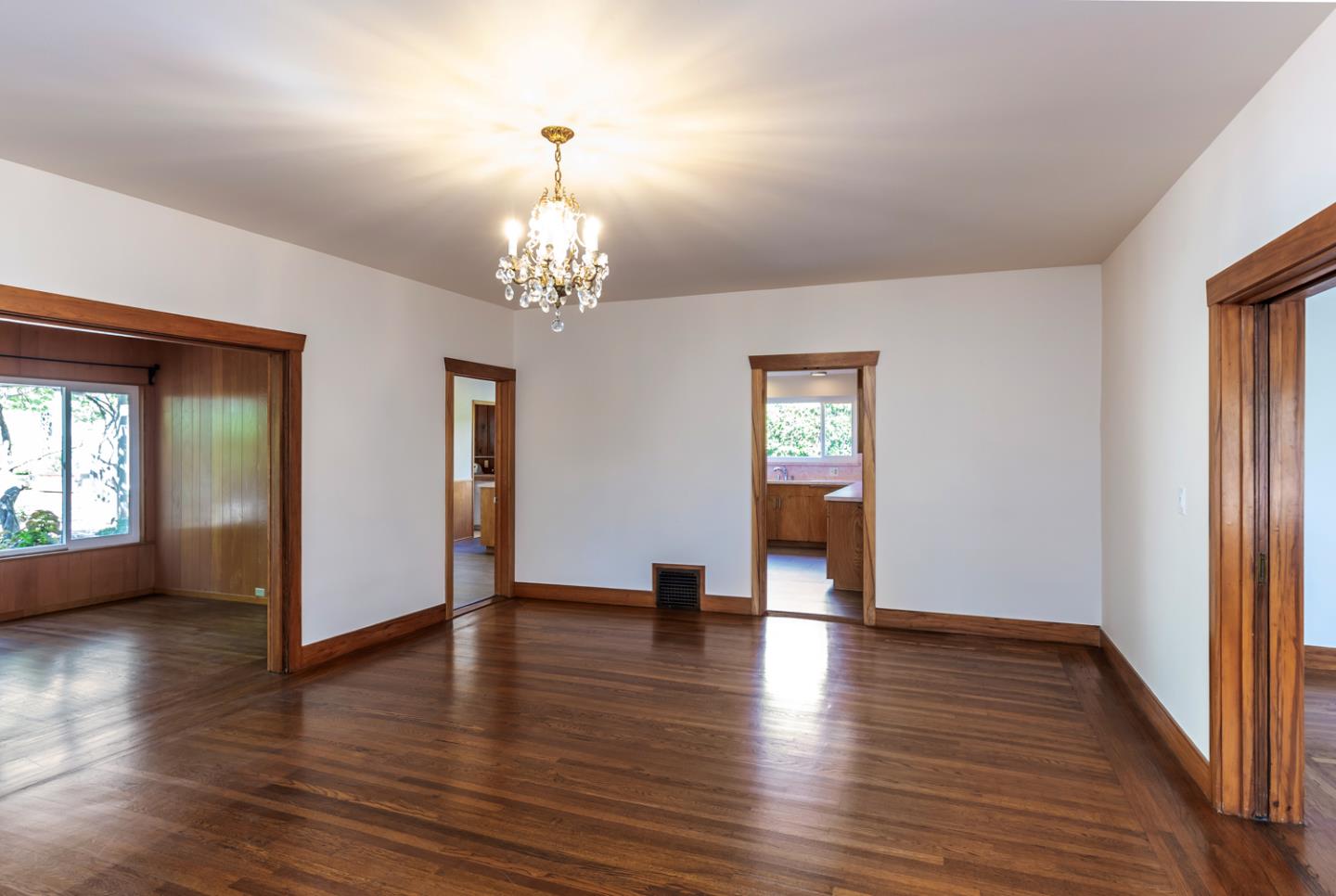 425 Hillcrest Road San Mateo, CA 94402 - Photo 16 of 48 a view of an empty room with wooden floor and a window