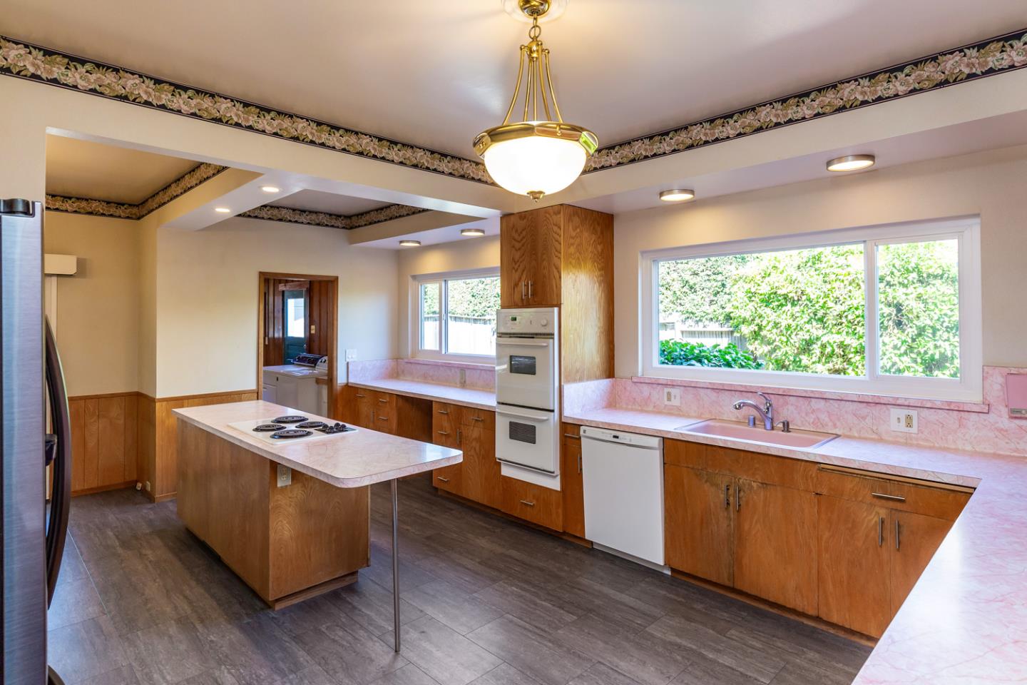 425 Hillcrest Road San Mateo, CA 94402 - Photo 18 of 48 a kitchen with stainless steel appliances granite countertop a stove and a refrigerator
