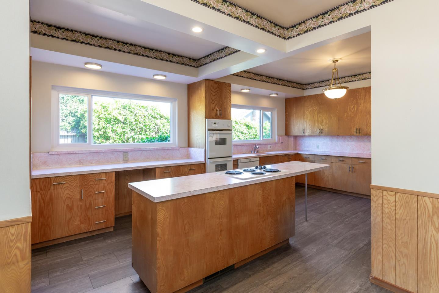 425 Hillcrest Road San Mateo, CA 94402 - Photo 19 of 48 a kitchen with sink a window and chairs