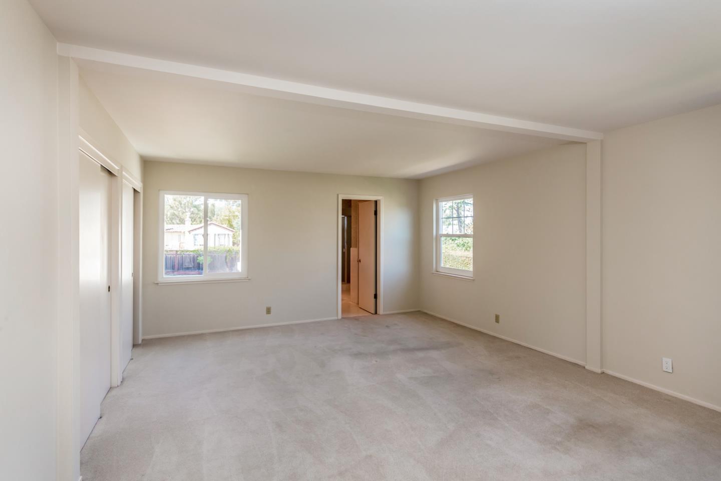 425 Hillcrest Road San Mateo, CA 94402 - Photo 22 of 48 a view of an empty room with a window