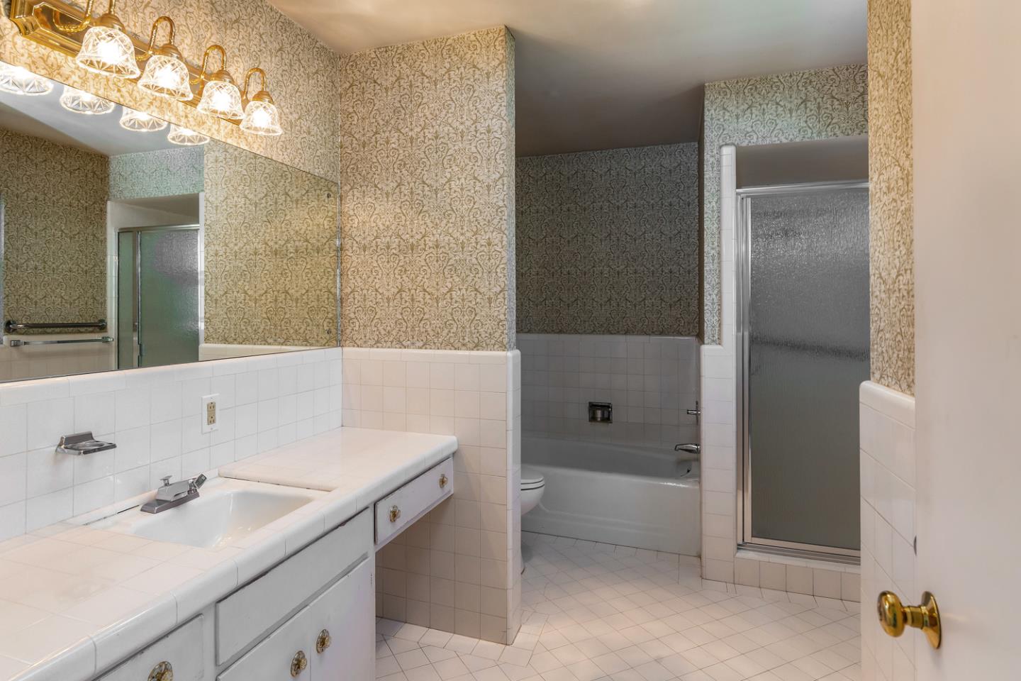 425 Hillcrest Road San Mateo, CA 94402 - Photo 24 of 48 a bathroom with a sink and a mirror