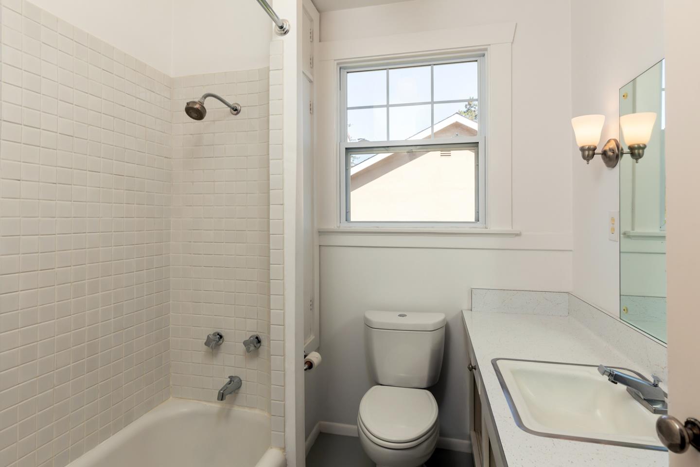425 Hillcrest Road San Mateo, CA 94402 - Photo 27 of 48 a white toilet sitting next to a bath tub