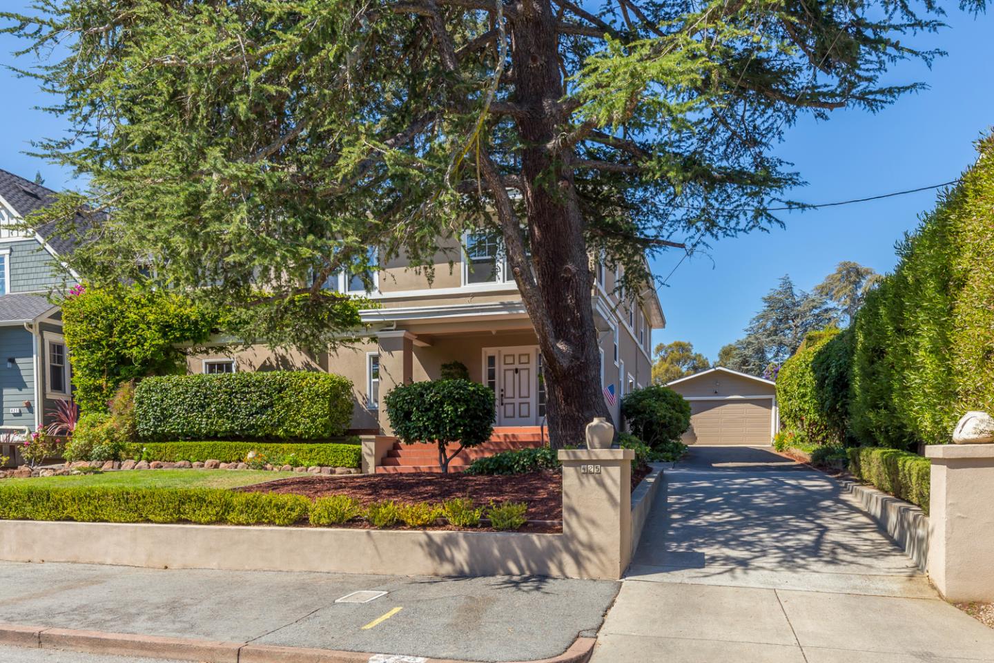 425 Hillcrest Road San Mateo, CA 94402 - Photo 42 of 48 a view of a house with a tree and plants