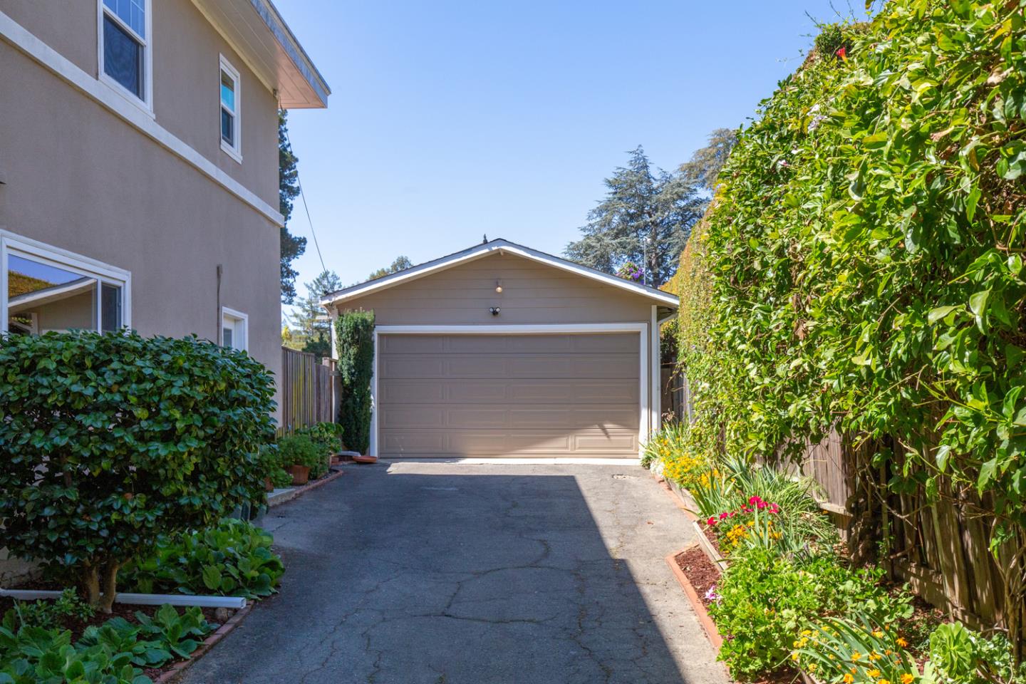 425 Hillcrest Road San Mateo, CA 94402 - Photo 43 of 48 a front view of a house with a yard and garage