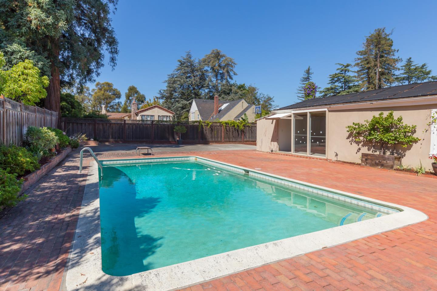 425 Hillcrest Road San Mateo, CA 94402 - Photo 9 of 48 a view of a backyard with a garden