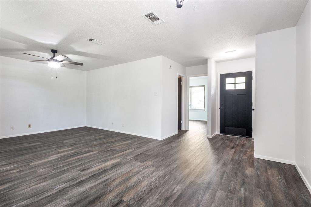3326 Gardenview Circle Denton, TX 76207 - Photo 2 of 13 a view of an empty room with wooden floor
