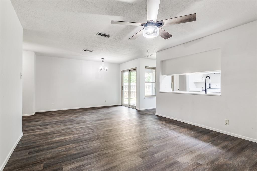 3326 Gardenview Circle Denton, TX 76207 - Photo 4 of 13 a view of an empty room with window and wooden floor