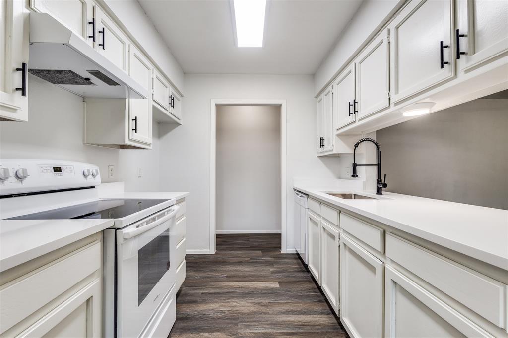 3326 Gardenview Circle Denton, TX 76207 - Photo 5 of 13 a kitchen with a sink stove and cabinets